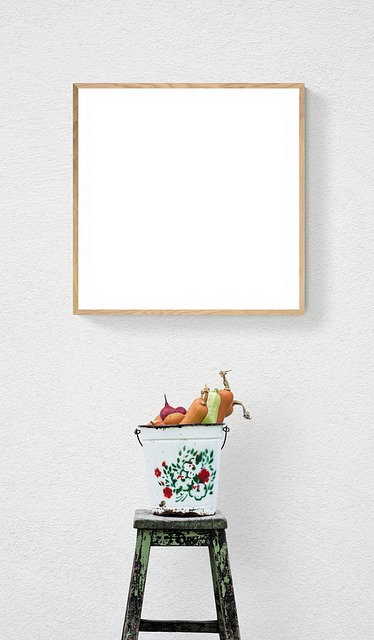 professional tiler washing back grout with sponge and bucket system on porcelain wall tiles in West Sussex